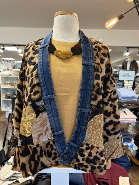 A leopard and denim patchwork jacket over a mustard knit