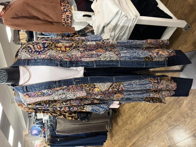 A patchwork paisley duster with denim trim, styled on a mannequin at Trendys Clothing