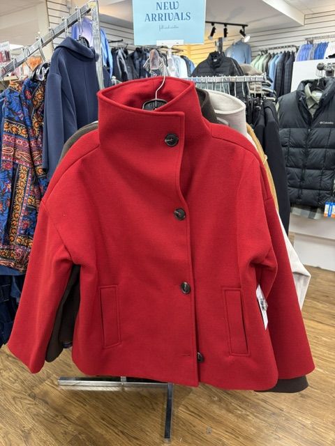 A red wool funnel-neck coat on display at Trendys